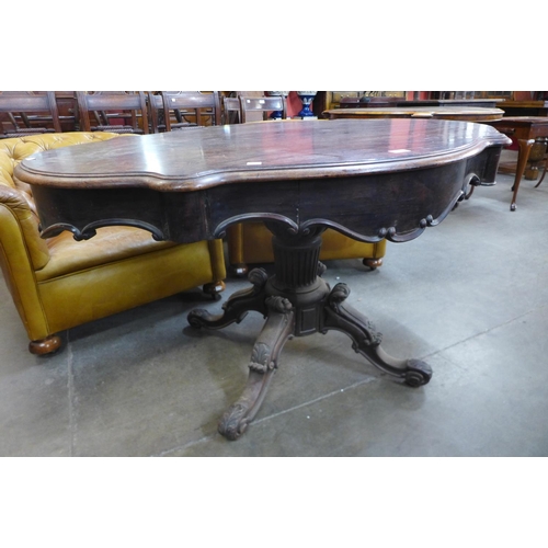 136 - A 19th Century French rosewood two drawer serpentine centre table