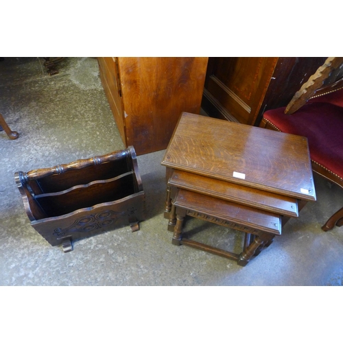 166 - An oak nest of tables and a newspaper stand