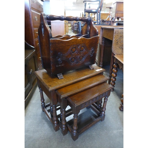 166 - An oak nest of tables and a newspaper stand