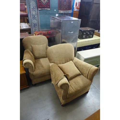 237 - A pair of upholstered sand fabric armchairs