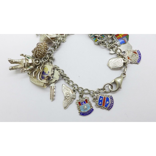 1006 - A silver charm bracelet including an astronaut charm, 53g