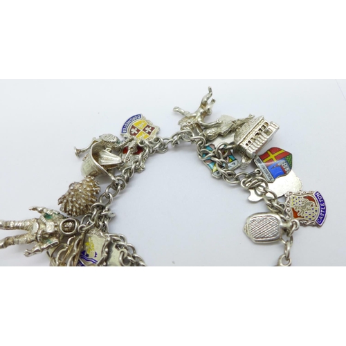 1006 - A silver charm bracelet including an astronaut charm, 53g