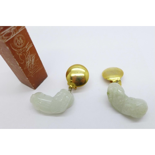 1023 - A pair of carved jade Dogs of Foe earrings, two jade pendants and a stone name seal, 'John'