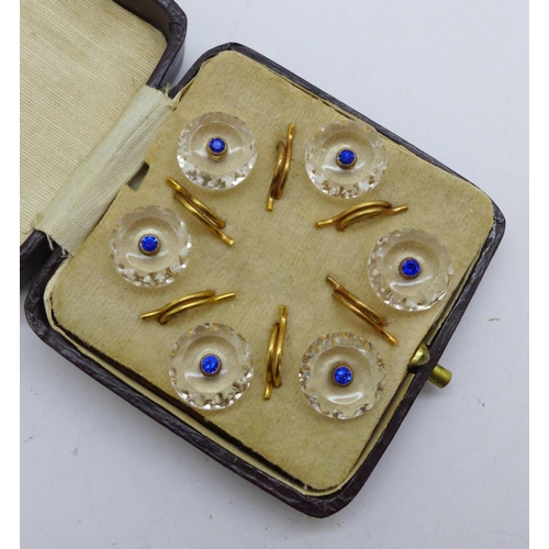 1031 - A cased set of six glass buttons set with blue crystal