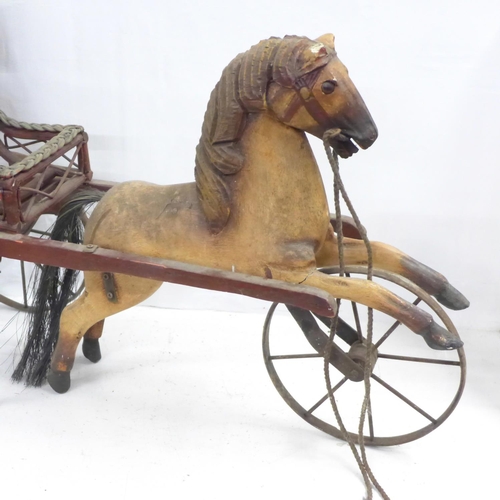 1048 - A wooden horse and carriage, one ear a/f