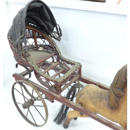 1048 - A wooden horse and carriage, one ear a/f