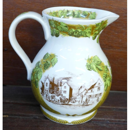 697 - A Poole pottery vase, a Mason's kettle and a Wade jug