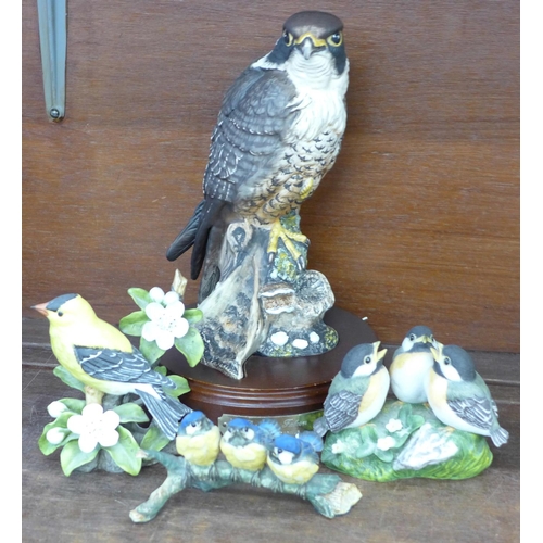 704 - A Royal Doulton limited edition Peregrine Falcon and three other models of birds, one model of Blue ... 