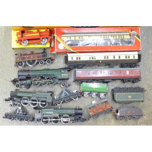 752 - A collection of OO gauge model railway including locomotives, Budgie railway engine lacking one whee... 