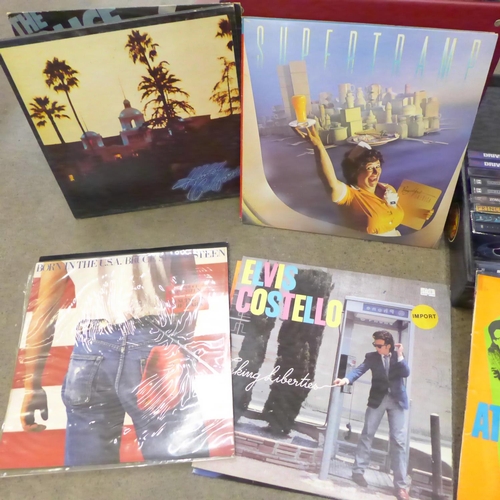 754 - A case of LP records, Elvis Costello, Police, David Bowie, Meatloaf, Dire Straits, etc., and a box o... 