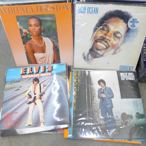 754 - A case of LP records, Elvis Costello, Police, David Bowie, Meatloaf, Dire Straits, etc., and a box o... 