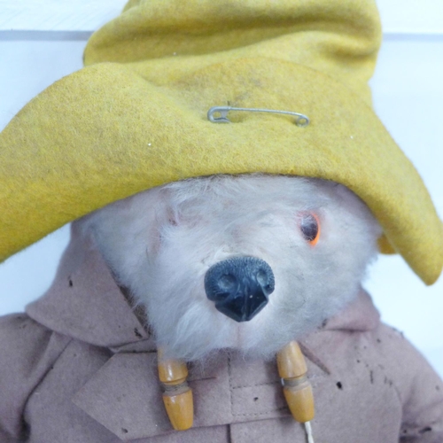 772 - A Gabrielle Designs Paddington Bear figure with red Dunlop Wellington boots, clothing with moth dama... 