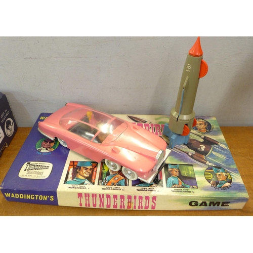 773 - A Waddington's Thunderbirds game, boxed and two Thunderbirds toys