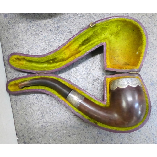 785 - A collection of pipes including Meerschaum, porcelain, clay, etc., one silver mounted