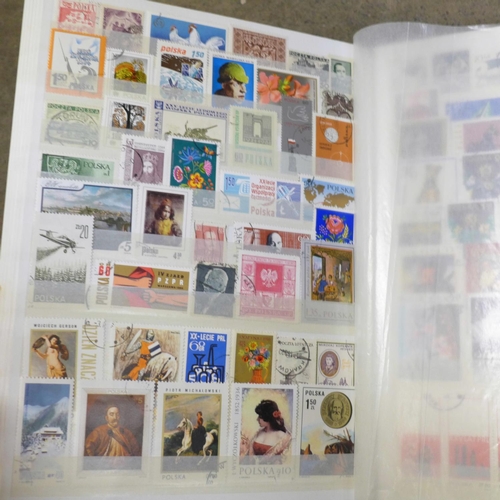 788 - Stamps; a box containing four albums of stamps, a Commonwealth catalogue and a boxed SG Simplex albu... 