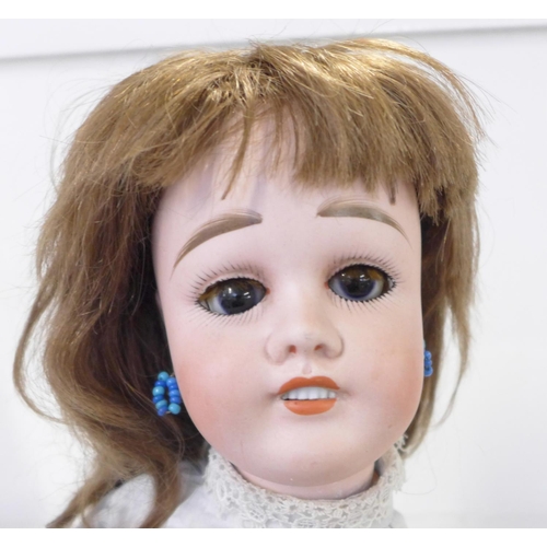 802 - A French Limoges bisque head doll with deep violet sleep eyes, Limoges 9 identification mark, right ... 