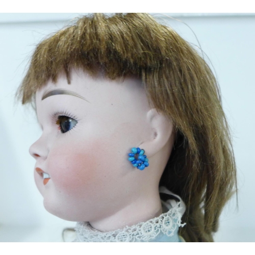 802 - A French Limoges bisque head doll with deep violet sleep eyes, Limoges 9 identification mark, right ... 