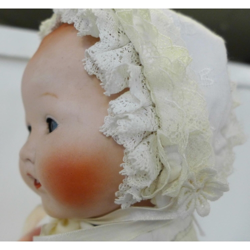 807 - A Japanese bisque head doll with blue sleep eyes, 500/4K identification mark, 1920's/30's, 45cm