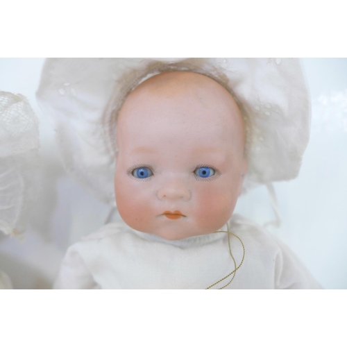 808 - A German Armand Marseille bisque head doll with blue sleep eyes, 341.12 identification mark, circa 1... 