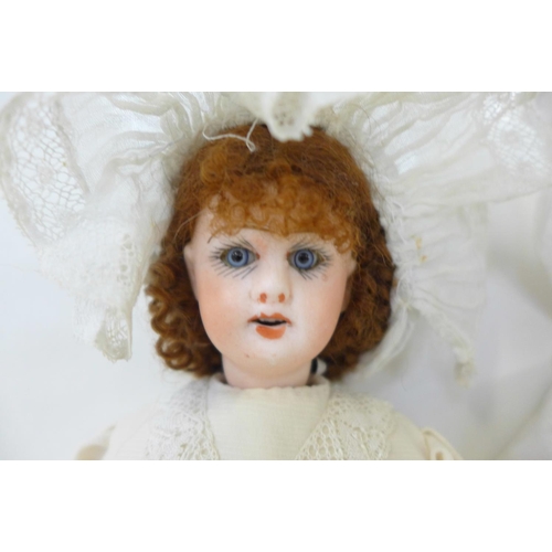 808 - A German Armand Marseille bisque head doll with blue sleep eyes, 341.12 identification mark, circa 1... 