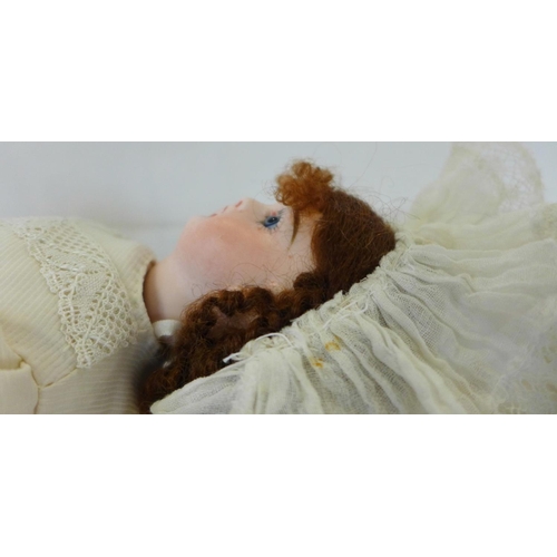 808 - A German Armand Marseille bisque head doll with blue sleep eyes, 341.12 identification mark, circa 1... 