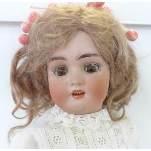 809 - A Simon & Halbig bisque head doll with brown sleep eyes, SH 6½ identification mark, circa 1910, 43cm