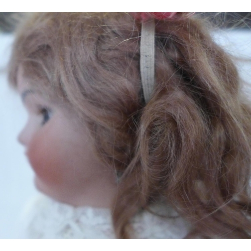 809 - A Simon & Halbig bisque head doll with brown sleep eyes, SH 6½ identification mark, circa 1910, 43cm