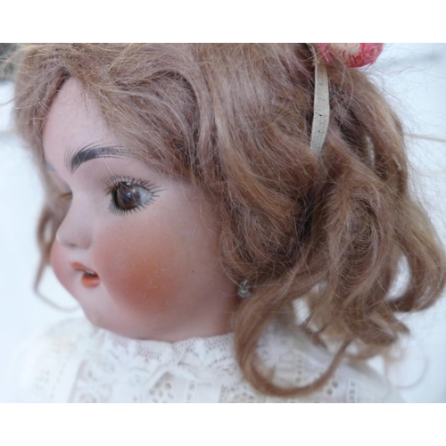 809 - A Simon & Halbig bisque head doll with brown sleep eyes, SH 6½ identification mark, circa 1910, 43cm