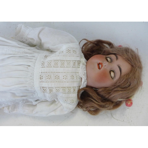 809 - A Simon & Halbig bisque head doll with brown sleep eyes, SH 6½ identification mark, circa 1910, 43cm