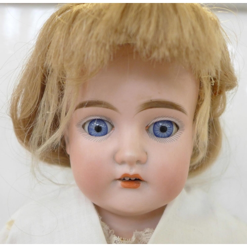 812 - A German Cuno Otto Dressel bisque head doll with blue sleep eyes, 1776 COD 5 DE(P) identification ma... 