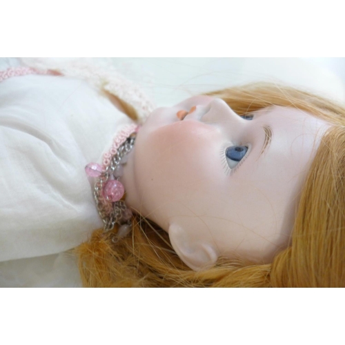 814 - A German C M Bergman bisque head doll with blue open eyes, 1916-8 identification mark, circa 1916, 5... 