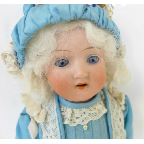 816 - A German Schaeun & Hoffmeister bisque head doll with blue sleep eyes, 1909-8 identification mark, ci... 