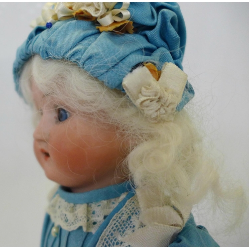 816 - A German Schaeun & Hoffmeister bisque head doll with blue sleep eyes, 1909-8 identification mark, ci... 