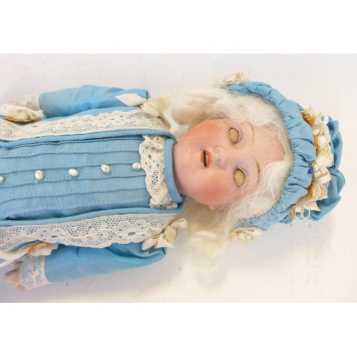 816 - A German Schaeun & Hoffmeister bisque head doll with blue sleep eyes, 1909-8 identification mark, ci... 