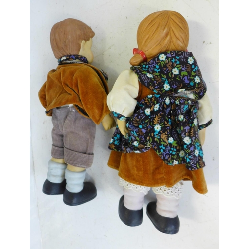 817 - A pair of Goebel style boy and girl dolls, 26cm