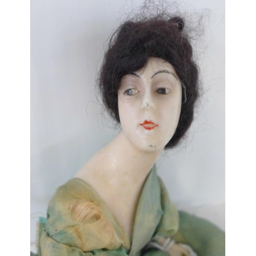 818 - A French wax boudoir doll with bisque arms, circa 1920's, 34cm