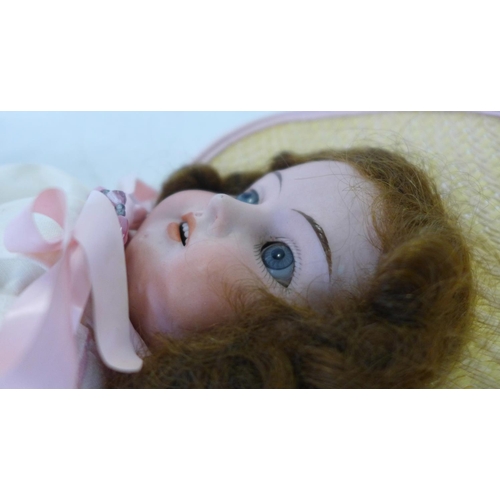 819 - A German bisque head doll, possibly Armand Marseille, with pale blue open eyes, 890 R 2/0M identific... 