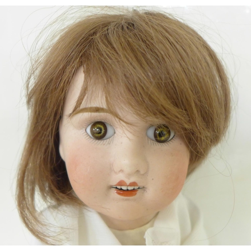 820 - A French Jules Verlingue bisque head doll with brown open eyes, JV 6 identification mark, circa 1900... 