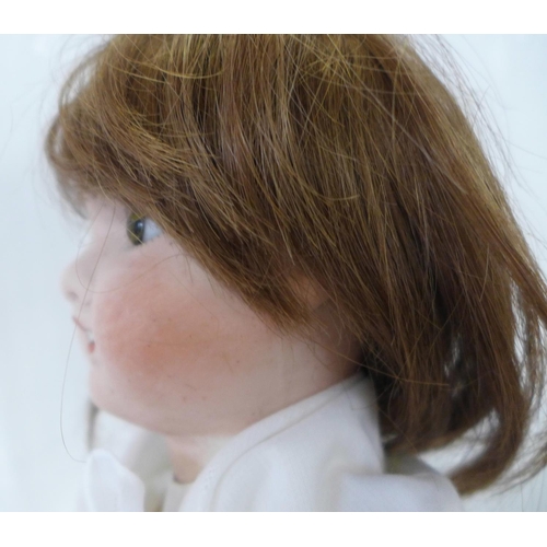 820 - A French Jules Verlingue bisque head doll with brown open eyes, JV 6 identification mark, circa 1900... 