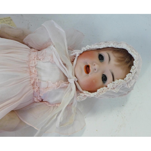 824 - A German Kammer & Reinhart for Simon & Halbig bisque head doll with blue flirty eyes, 126 identifica... 