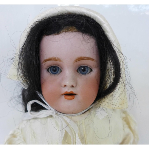 825 - A German Simon & Halbig bisque head doll with pale blue sleep eyes, 1079 DEP 6 identification mark, ... 