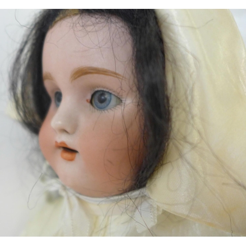 825 - A German Simon & Halbig bisque head doll with pale blue sleep eyes, 1079 DEP 6 identification mark, ... 