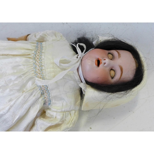 825 - A German Simon & Halbig bisque head doll with pale blue sleep eyes, 1079 DEP 6 identification mark, ... 