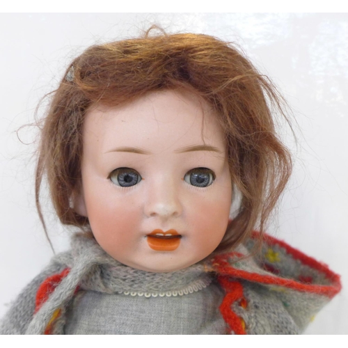 826 - A German Gebruder Ohihauer-Revalo bisque head doll with blue sleep eyes, Revelo 22-10 identification... 