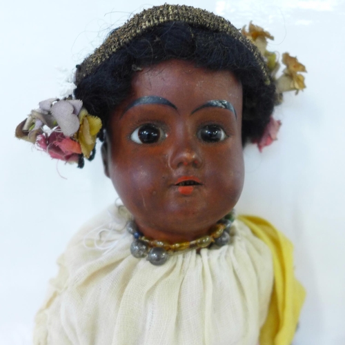 830 - A German bisque head doll with brown open eyes, 1321 identification mark and a brown painted bisque ... 