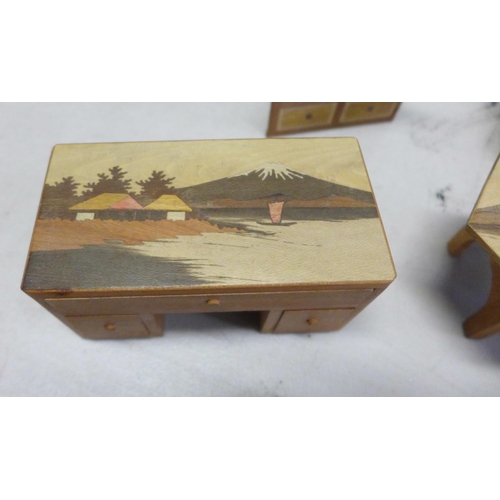 834 - A collection of 1930's dolls house furniture with inlaid decoration, some with Japanese landscape sc... 