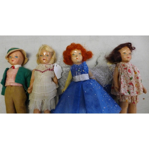 836 - Eight Rosebud composition dolls, circa 1930's-1940's and a wooden doll