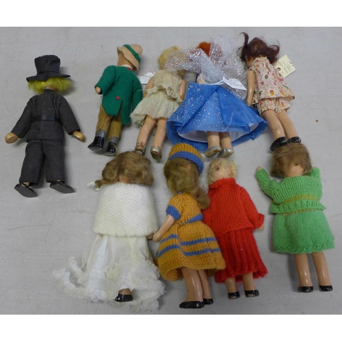 836 - Eight Rosebud composition dolls, circa 1930's-1940's and a wooden doll