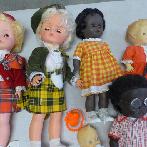 839 - Nine dolls, Palitoy x2, black x3 and four others including a toy bench