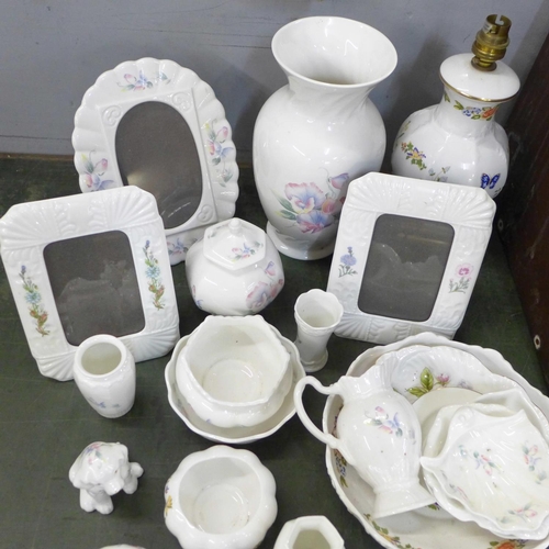 849 - A collection of Aynsley china including a table lamp base, a vase, three photograph frames, etc.